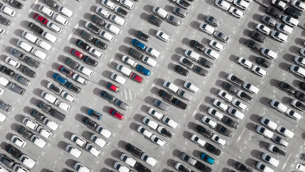 Vehicles in parking lot ready to be moved